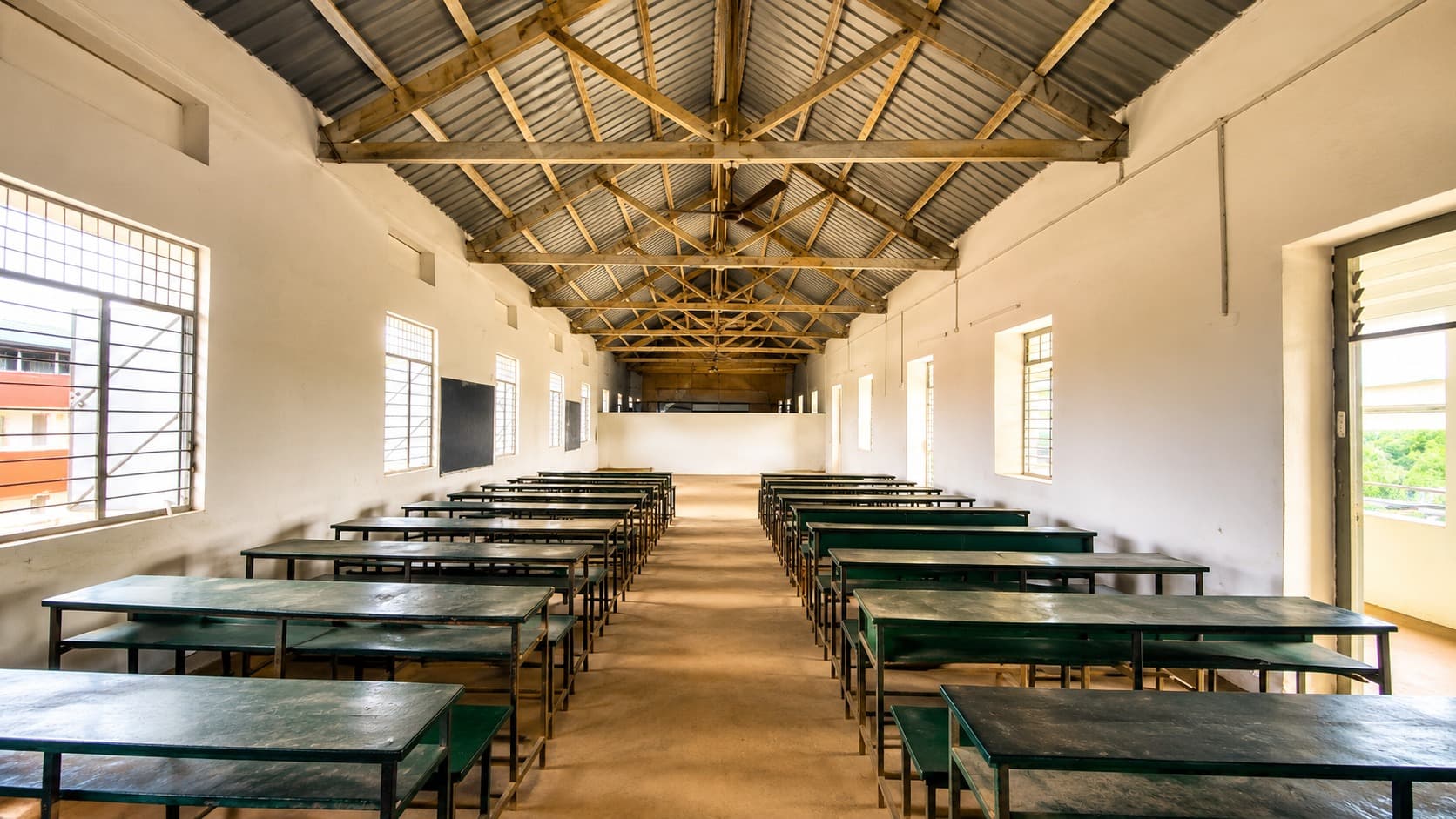 Multimedia hall — repaired roof trusses over rows of benches