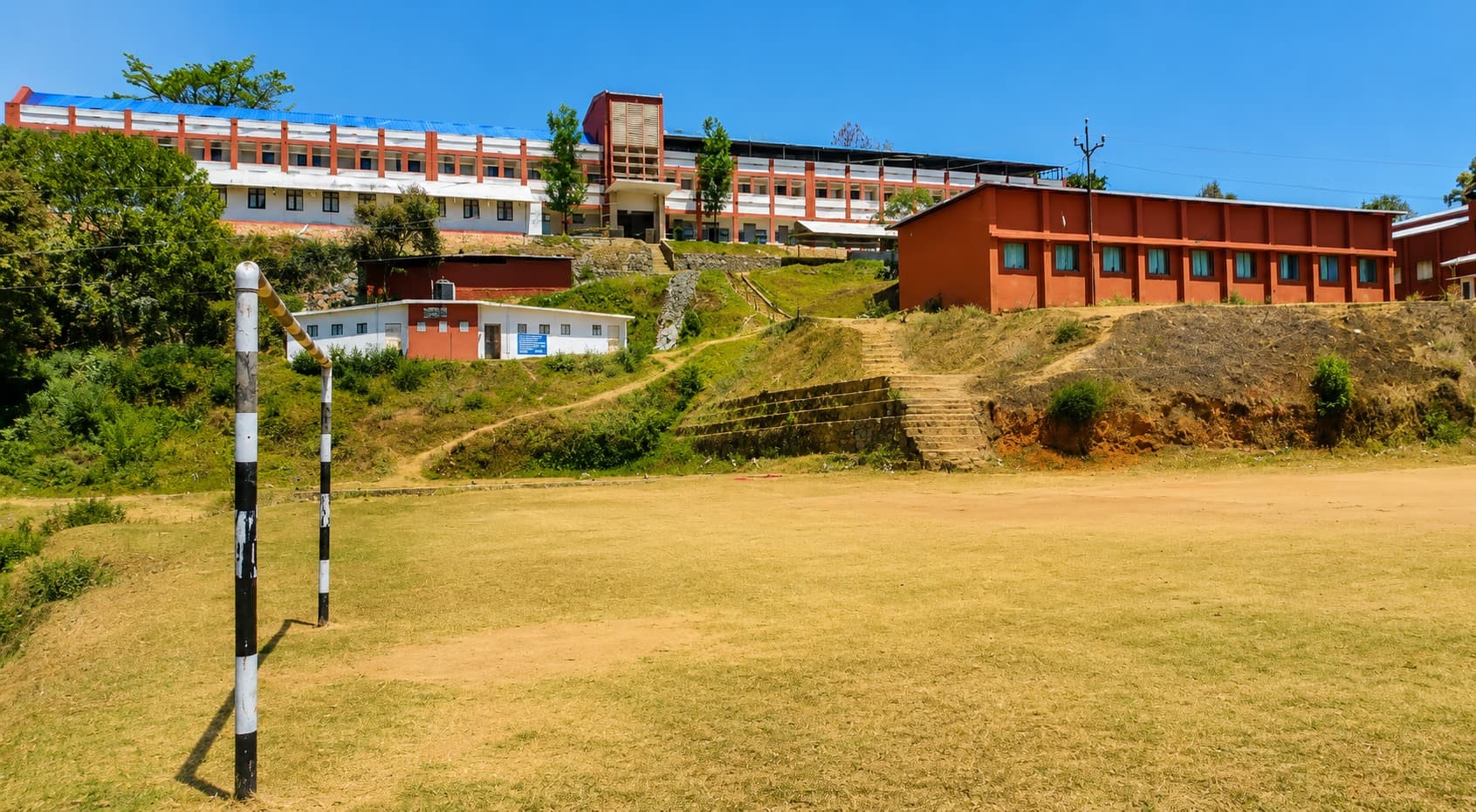 Campus overview — steps up the hillside to the classroom blocks