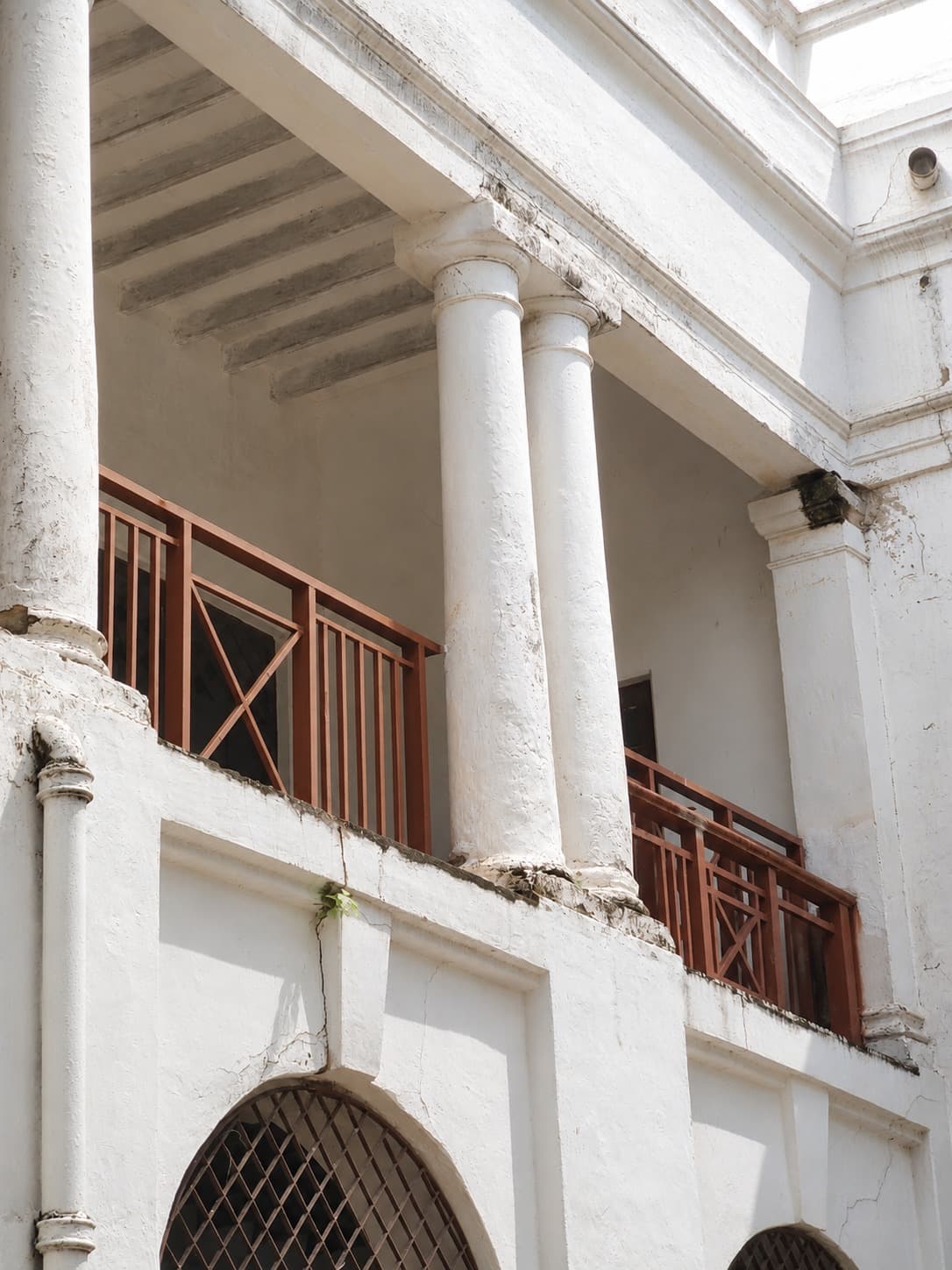 Colonnade — arcade with restored balustrade and grille windows