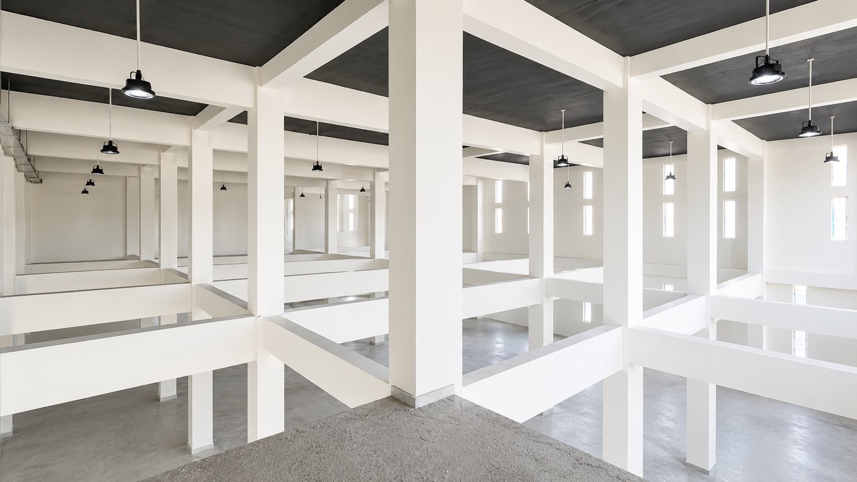 Interior — mezzanine display floor with pendant lighting